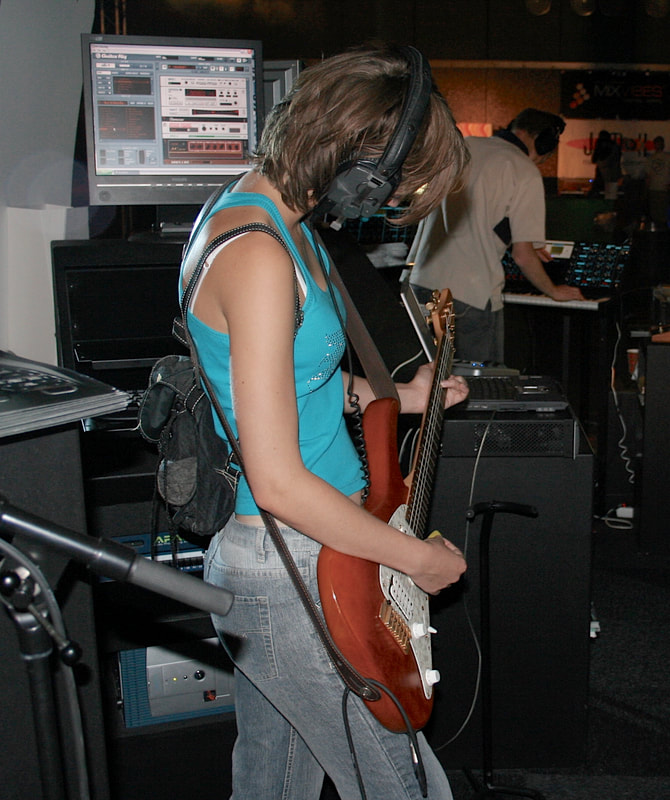 Guitar Girl - headphones in studio