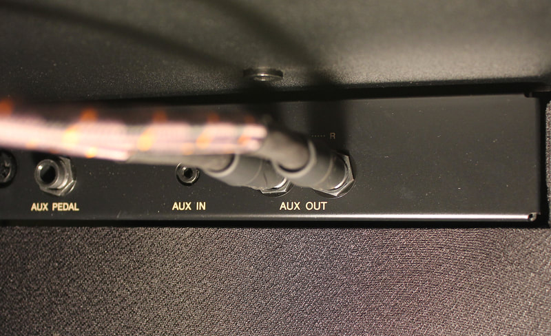 1/4" TS unbalanced instrument cables connected to Aux Out